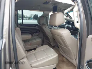 2015 Chevrolet Suburban LT z VIN 1GNSCJKC6FR675585, wystawiony jako IAAI lot #41510570 z przebiegiem 156 818 mil mil oraz . Historia ofert i sprzedaży dostępna na DreamBid. Obrazek 8.