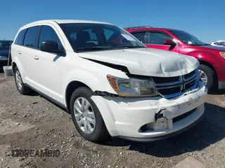 2013 Dodge Journey SE with VIN 3C4PDCAB0DT695464, listed as a IAAI auction lot 41899206 with 311,327 mi miles. Bid and sale history available at carsss.com. Image 1.