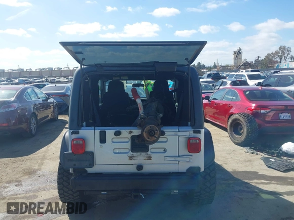 2004 Jeep Wrangler Rubicon with VIN 1J4FA69S94P701660, listed as a IAAI auction lot 41699554 with 74,640 mi miles. Bid and sale history available at carsss.com. Image 17.