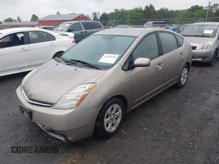 2006 Toyota Prius z VIN JTDKB20U067517414, wystawiony jako IAAI lot #42251158 z przebiegiem 233 266 mil mil oraz . Historia ofert i sprzedaży dostępna na DreamBid. Obrazek 2.