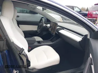 2019 Tesla Model 3 Long Range with VIN 5YJ3E1EB8KF512950, listed as a IAAI auction lot 41836349 with 55,607 mi miles and . Bid and sale history available at DreamBid. Image 5.