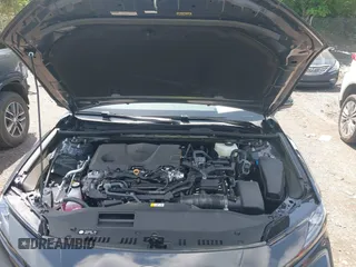 2025 Toyota Camry LE with VIN 4T1DAACK6SU584011, listed as a IAAI auction lot 42119086 with 7,229 mi miles and . Bid and sale history available at DreamBid. Image 10.