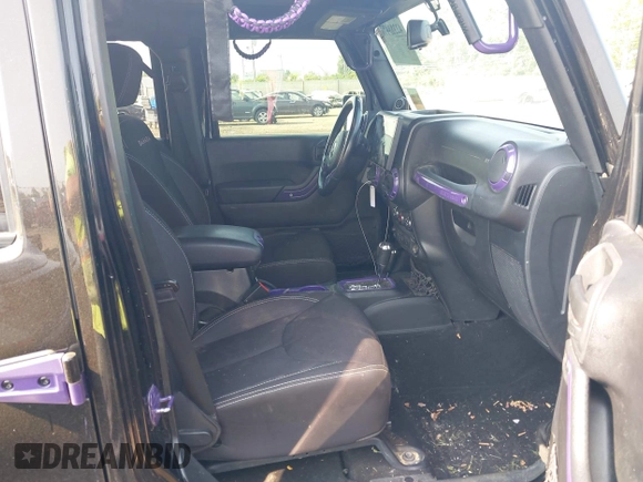 2014 Jeep Wrangler Unlimited Sahara with VIN 1C4BJWEG6EL217945, listed as a IAAI auction lot 42388477 with 61,739 mi miles and . Bid and sale history available at DreamBid. Image 5.