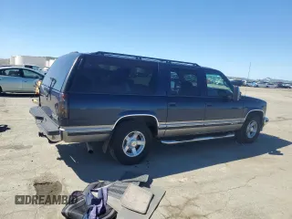 1999 Chevrolet Suburban with VIN 1GNEC16R1XJ394144, listed as a Copart auction lot 50418185 with 173,037 mi miles and Salvage title. Bid and sale history available at DreamBid. Image 3.