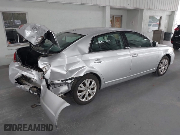 2009 Toyota Avalon XL with VIN 4T1BK36B69U341854, listed as a IAAI auction lot 41727553 with 102,369 mi miles. Bid and sale history available at carsss.com. Image 4.