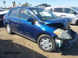 2009 Nissan Versa 1.8 S with VIN 3N1BC11E29L360857, listed as a IAAI auction lot 40629379 with 114,499 mi miles. Bid and sale history available at carsss.com. Image 1.
