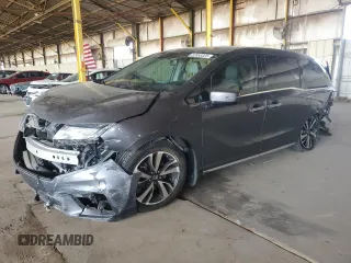 2018 Honda Odyssey Elite z VIN 5FNRL6H97JB020611, wystawiony jako Copart lot #57953325 z przebiegiem Nie podano mil oraz Szkoda całkowita • Salvage title. Historia ofert i sprzedaży dostępna na DreamBid. Obrazek 1.