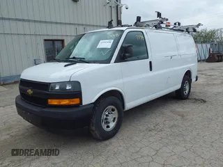 2018 Chevrolet Express Cargo Van with VIN 1GCWGAFP1J1322142, listed as a IAAI auction lot 41952498 with 155,218 mi miles. Bid and sale history available at carsss.com. Image 2.