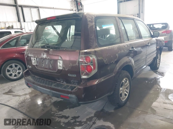 2007 Honda Pilot LX with VIN 2HKYF18137H519304, listed as a IAAI auction lot 42203155 with 128,712 mi miles and . Bid and sale history available at DreamBid. Image 4.