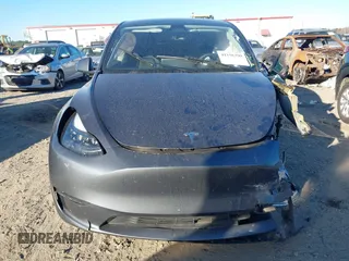 2023 Tesla Model Y Long Range with VIN 7SAYGDEE1PF647841, listed as a IAAI auction lot 41156390 with 33,473 mi miles. Bid and sale history available at carsss.com. Image 11.