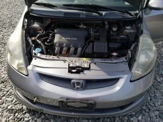 2007 Honda Fit Sport z VIN JHMGD37677S001013, wystawiony jako Copart lot #58792605 z przebiegiem 157 960 mil mil oraz Czysty tytuł • Clean title. Historia ofert i sprzedaży dostępna na DreamBid. Obrazek 11.
