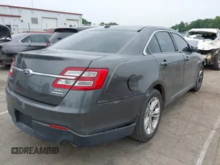 2015 Ford Taurus SEL z VIN 1FAHP2E81FG163058, wystawiony jako IAAI lot #42279778 z przebiegiem 127 957 mil mil oraz . Historia ofert i sprzedaży dostępna na DreamBid. Obrazek 4.