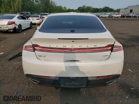 2014 Lincoln MKZ Hybrid z VIN 3LN6L2LU5ER823084, wystawiony jako Copart lot #59597565 z przebiegiem 126 402 mil mil oraz Szkoda całkowita • Salvage title. Historia ofert i sprzedaży dostępna na DreamBid. Obrazek 6.