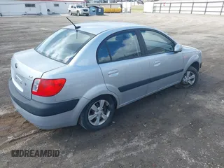 2009 Kia Rio LX with VIN KNADE223796521410, listed as a IAAI auction lot 41887883 with 82,360 mi miles and . Bid and sale history available at DreamBid. Image 4.