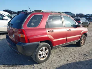 2005 Kia Sportage LX with VIN KNDJF723457078461, listed as a IAAI auction lot 41948080 with 104,330 mi miles. Bid and sale history available at carsss.com. Image 4.
