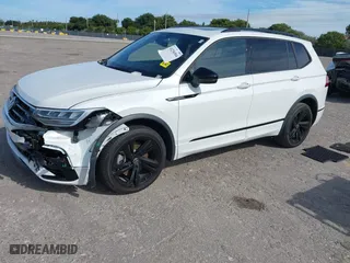 2023 Volkswagen Tiguan SE R-Line Black with VIN 3VVCB7AX0PM090710, listed as a IAAI auction lot 41256904 with 12,819 mi miles. Bid and sale history available at carsss.com. Image 2.