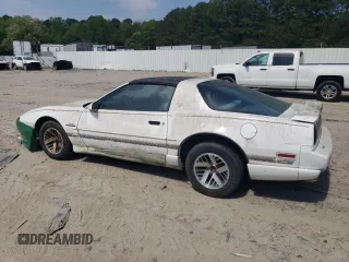 1991 Pontiac Firebird z VIN 1G2FS23E5ML239639, wystawiony jako Copart lot #54986095 z przebiegiem 154 017 mil mil oraz Tytuł czysty. Historia ofert i sprzedaży dostępna na DreamBid. Obrazek 2.