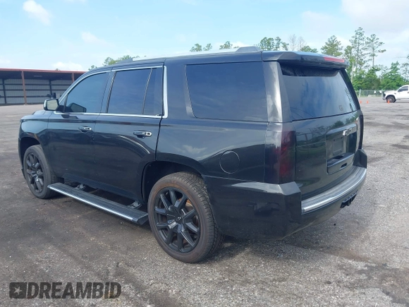 2015 Chevrolet Tahoe LTZ with VIN 1GNSCCKC5FR103676, listed as a IAAI auction lot 42456913 with 214,009 mi miles and . Bid and sale history available at DreamBid. Image 3.