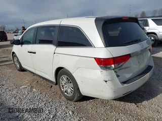 2014 Honda Odyssey LX with VIN 5FNRL5H24EB001551, listed as a IAAI auction lot 41879040 with 119,200 mi miles and . Bid and sale history available at DreamBid. Image 3.