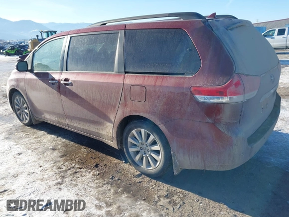 2014 Toyota Sienna XLE with VIN 5TDYK3DC5ES425818, listed as a IAAI auction lot 41421282 with 105,586 mi miles and . Bid and sale history available at DreamBid. Image 3.