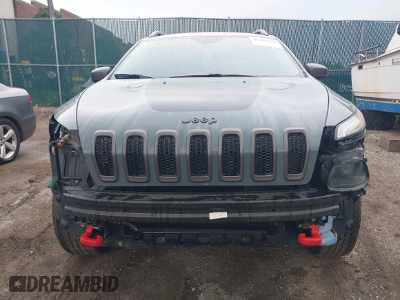 2014 Jeep Cherokee Trailhawk with VIN 1C4PJMBB5EW156315, listed as a IAAI auction lot 42426229 with 154,019 mi miles and . Bid and sale history available at DreamBid. Image 13.