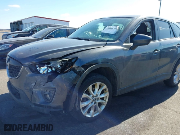 2014 Mazda CX-5 Grand Touring with VIN JM3KE4DY1E0364685, listed as a IAAI auction lot 41665349 with 135,751 mi miles. Bid and sale history available at carsss.com. Image 6.