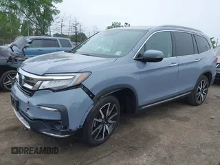 2022 Honda Pilot Touring 7-Passenger with VIN 5FNYF6H68NB056077, listed as a IAAI auction lot 42357338 with 18,193 mi miles and . Bid and sale history available at DreamBid. Image 2.