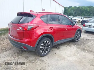 2016 Mazda CX-5 Grand Touring z VIN JM3KE2DY6G0693678, wystawiony jako IAAI lot #42443247 z przebiegiem 127 620 mil mil oraz . Historia ofert i sprzedaży dostępna na DreamBid. Obrazek 4.