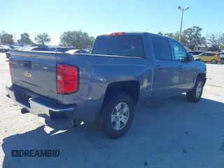 2016 Chevrolet Silverado 1500 LT with VIN 3GCUKREC8GG219524, listed as a IAAI auction lot 41087657 with 123,010 mi miles and . Bid and sale history available at DreamBid. Image 4.