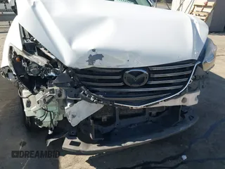2016 Mazda CX-5 Sport with VIN JM3KE2BY9G0890587, listed as a IAAI auction lot 41685344 with 91,190 mi miles. Bid and sale history available at carsss.com. Image 10.