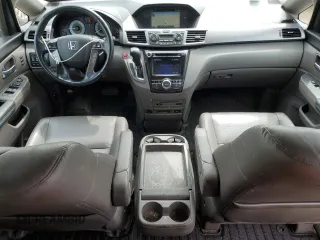 2015 Honda Odyssey Touring Elite z VIN 5FNRL5H96FB047204, wystawiony jako Copart lot #56297985 z przebiegiem 125 482 mil mil oraz Szkoda całkowita • Salvage title. Historia ofert i sprzedaży dostępna na DreamBid. Obrazek 8.