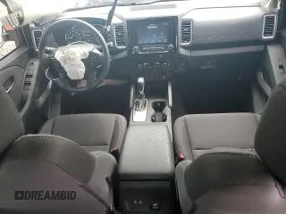 2024 Nissan Frontier SV with VIN 1N6ED1FJ1RN659511, listed as a Copart auction lot 57138225 with 21,933 mi miles and Salvage title. Bid and sale history available at DreamBid. Image 8.