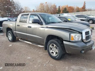 2007 Dodge Dakota SLT z VIN 1D7HW48P57S216313, wystawiony jako IAAI lot #41319321 z przebiegiem 116 712 mil mil oraz . Historia ofert i sprzedaży dostępna na DreamBid. Obrazek 1.