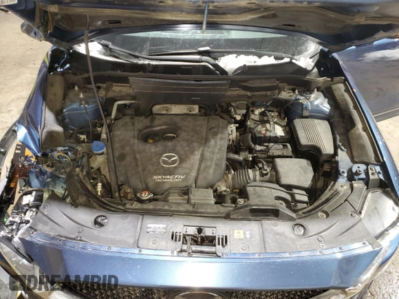 2018 Mazda CX-5 Grand Touring with VIN JM3KFBDM1J0304706, listed as a Copart auction lot 46123415 with 104,004 mi miles and Salvage title. Bid and sale history available at DreamBid. Image 12.
