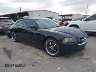2014 Dodge Charger SE with VIN 2C3CDXBG2EH187978, listed as a IAAI auction lot 41246875 with 106,635 mi miles and . Bid and sale history available at DreamBid. Image 1.