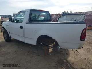 1999 Ford F-150 Work Series with VIN 1FTZF1728XKA04105, listed as a IAAI auction lot 41856047 with 176,890 mi miles. Bid and sale history available at carsss.com. Image 3.