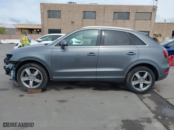 2015 Audi Q3 2.0T Premium Plus with VIN WA1EFCFSXFR009768, listed as a IAAI auction lot 41974476 with 53,013 mi miles. Bid and sale history available at carsss.com. Image 15.