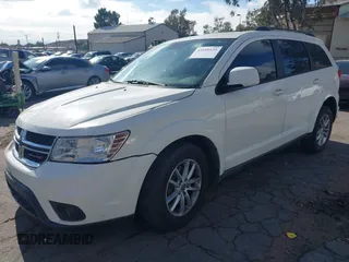 2014 Dodge Journey SXT with VIN 3C4PDCBG5ET126637, listed as a IAAI auction lot 41499125 with 165,107 mi miles. Bid and sale history available at carsss.com. Image 2.