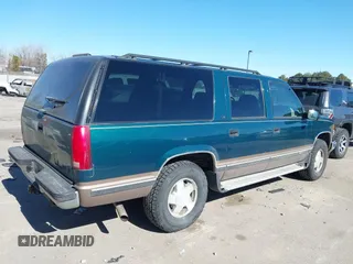 1997 Chevrolet Suburban with VIN 3GNFK16R9VG184722, listed as a IAAI auction lot 41662635 with 176,652 mi miles. Bid and sale history available at carsss.com. Image 4.