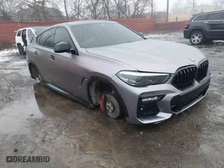 2021 BMW X6 xDrive40i with VIN 5UXCY6C07M9G44005, listed as a IAAI auction lot 41428636 with 65,670 mi miles. Bid and sale history available at carsss.com. Image 1.