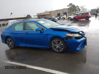 2019 Toyota Camry LE z VIN 4T1B11HK1KU282870, wystawiony jako IAAI lot #41799625 z przebiegiem 63 977 mil mil oraz . Historia ofert i sprzedaży dostępna na DreamBid. Obrazek 13.