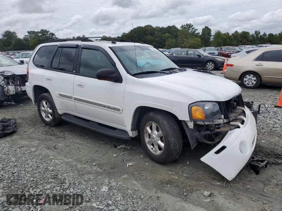 2005 GMC Envoy SLT with VIN 1GKDS13S652330496, listed as a Copart auction lot 73317234 with 191,138 mi miles and Salvage Title. Bid and sale history available at DreamBid. Image 4.