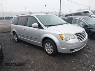 2010 Chrysler Town & Country Touring Plus with VIN 2A4RR8D19AR442324, listed as a IAAI auction lot 42018750 with 148,886 mi miles. Bid and sale history available at carsss.com. Image 1.