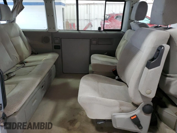 2003 Volkswagen EuroVan MV с VIN WV2NB47073H001005, выставлен на аукционе Copart как лот 87284844 с пробегом 283 979 миль миль и Чистый • Clean title. История ставок и продаж доступна на DreamBid. Изображение 11.