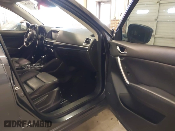 2016 Mazda CX-5 Grand Touring with VIN JM3KE2DYXG0846787, listed as a IAAI auction lot 41346364 with 113,553 mi miles. Bid and sale history available at carsss.com. Image 5.