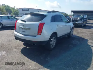 2013 Cadillac SRX Luxury Collection with VIN 3GYFNCE33DS608040, listed as a IAAI auction lot 41912860 with 128,295 mi miles and . Bid and sale history available at DreamBid. Image 4.