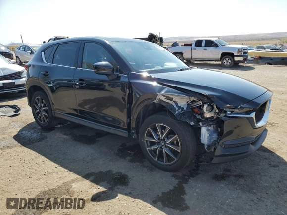 2018 Mazda CX-5 Grand Touring with VIN JM3KFADM9J1336792, listed as a Copart auction lot 52209435 with 107,852 mi miles and Salvage Title. Bid and sale history available at DreamBid. Image 4.