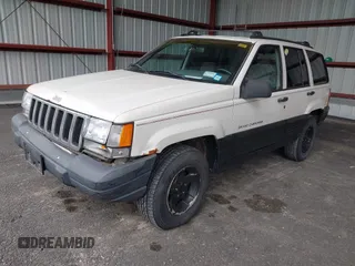 1997 Jeep Grand Cherokee Laredo z VIN 1J4GZ58S7VC737980, wystawiony jako IAAI lot #42256142 z przebiegiem 188 958 mil mil oraz . Historia ofert i sprzedaży dostępna na DreamBid. Obrazek 2.