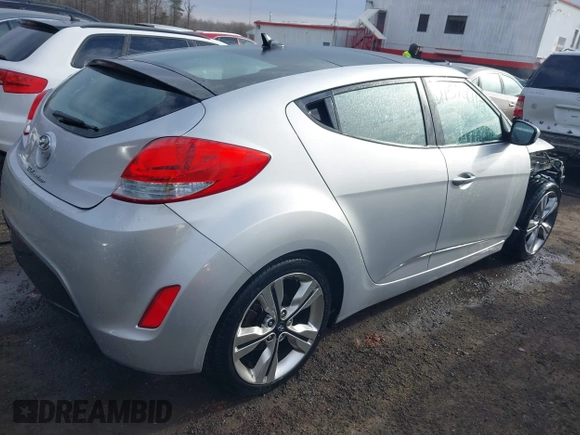 2017 Hyundai Veloster with VIN KMHTC6AD2HU324740, listed as a IAAI auction lot 41574415 with 66,685 mi miles. Bid and sale history available at carsss.com. Image 4.