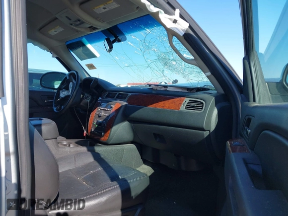 2013 Chevrolet Tahoe LT with VIN 1GNSKBE01DR157083, listed as a IAAI auction lot 41759189 with 153,403 mi miles and . Bid and sale history available at DreamBid. Image 5.